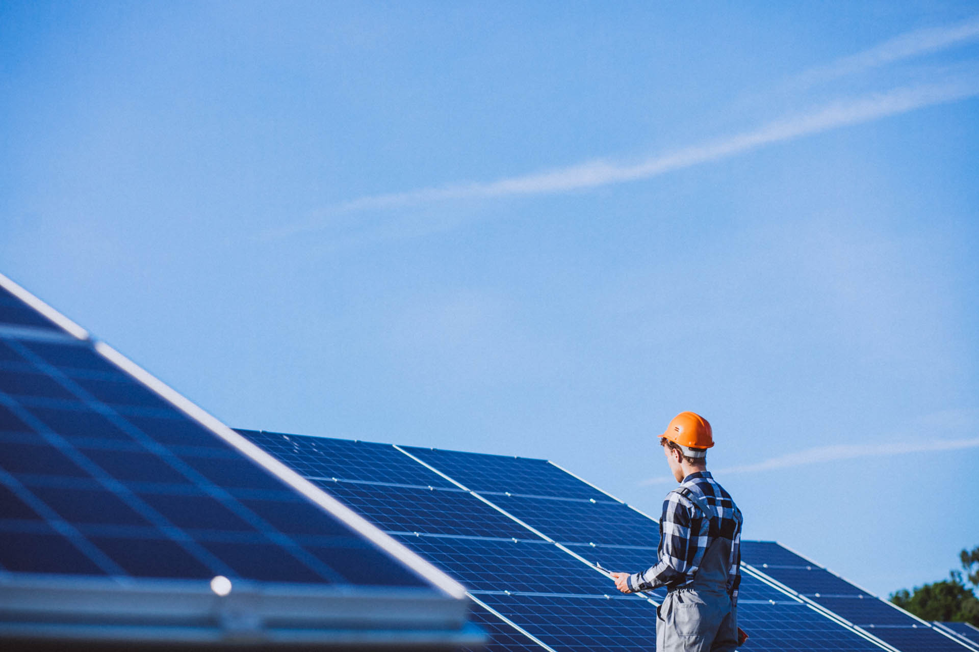 man-worker-firld-by-solar-panels